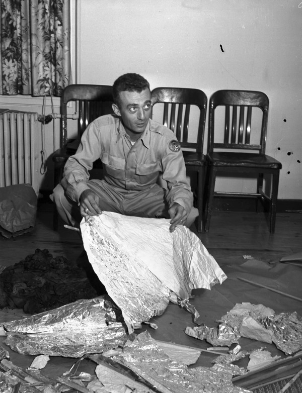 Major Jesse A. Marcel of Houma, LA holding foil debris from Roswell, New Mexico UFO crash site, July 1947.